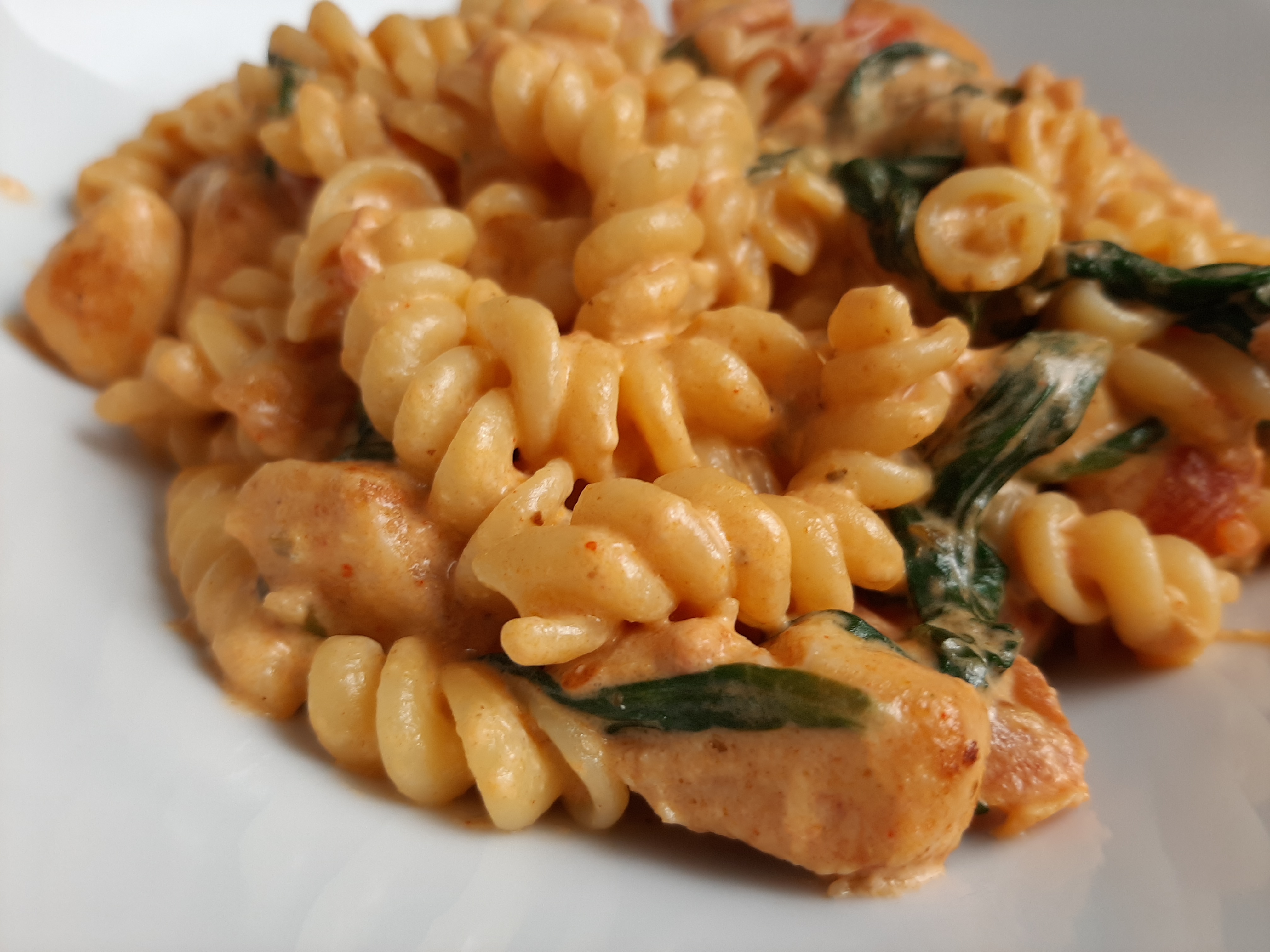 CHICKEN PASTA WITH BACON AND SPINACH IN A CREAMY TOMATO SAUCE